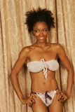 Sexy pretty woman wearing CharmaineLouise Intimates CLIntimates Ginger purple cashmere silk crochet strapless bra purple crochet string bikini panties